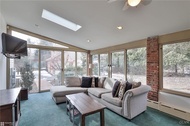 interior space with ceiling fan, carpet floors, lofted ceiling with skylight, and a baseboard radiator