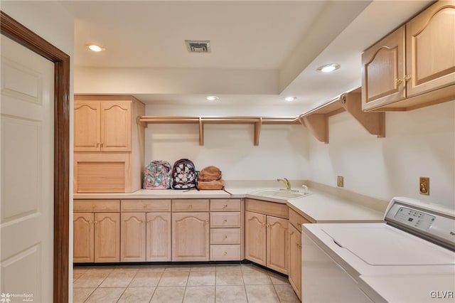 washroom with light tile patterned floors, recessed lighting, a sink, visible vents, and cabinet space