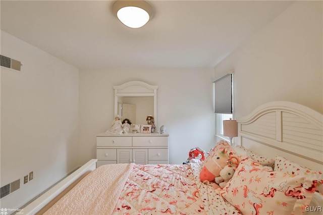 bedroom featuring visible vents