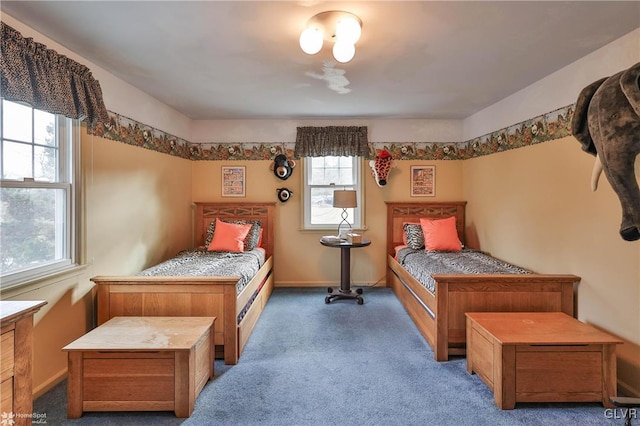 carpeted bedroom with baseboards