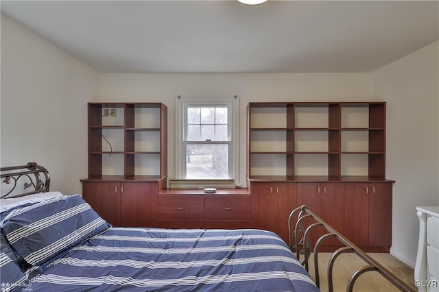 bedroom featuring light carpet