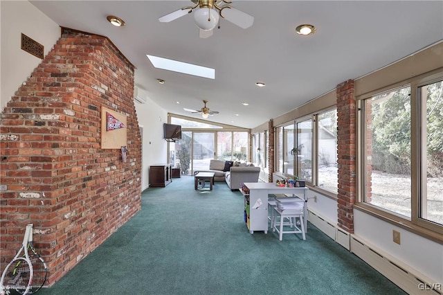 unfurnished sunroom with lofted ceiling with skylight, a baseboard heating unit, and a ceiling fan