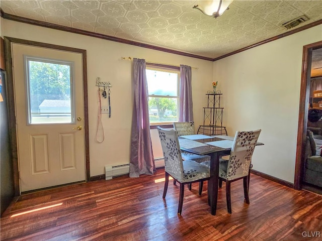 dining room with wood finished floors, visible vents, baseboards, ornamental molding, and an ornate ceiling