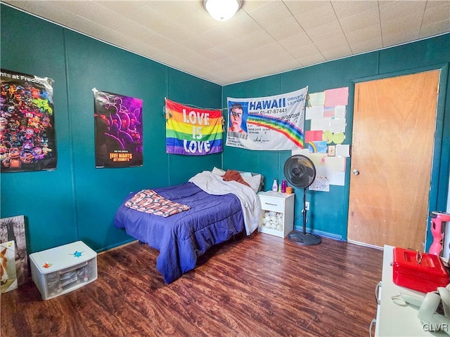 bedroom featuring wood finished floors