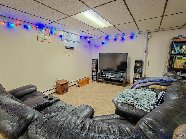 home theater with a baseboard heating unit, carpet floors, and a paneled ceiling