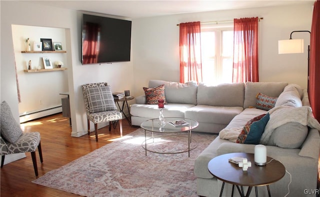 living room with a baseboard radiator and wood finished floors