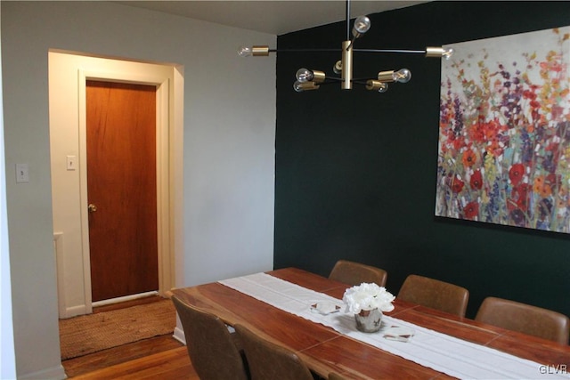 dining area with wood finished floors