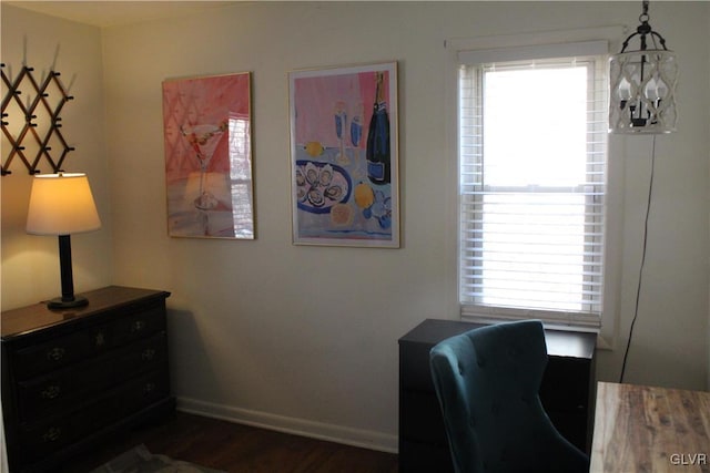 office space with dark wood-type flooring and baseboards