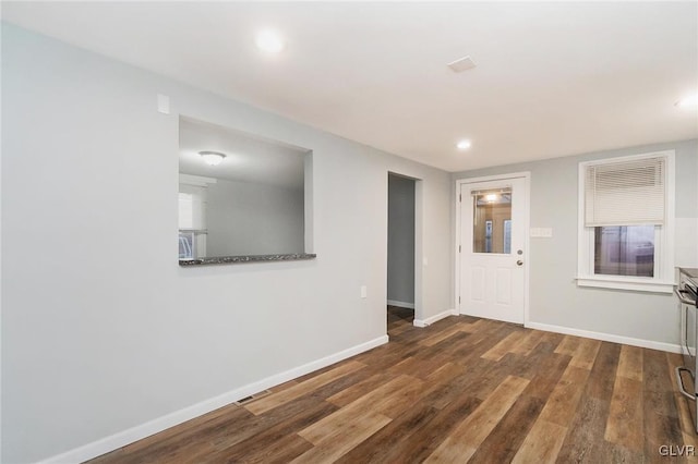 interior space with recessed lighting, visible vents, dark wood finished floors, and baseboards