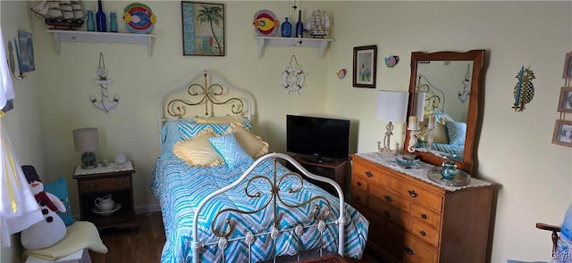 bedroom featuring dark wood-type flooring