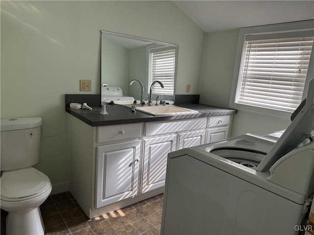 laundry area featuring a sink, washer / dryer, and laundry area