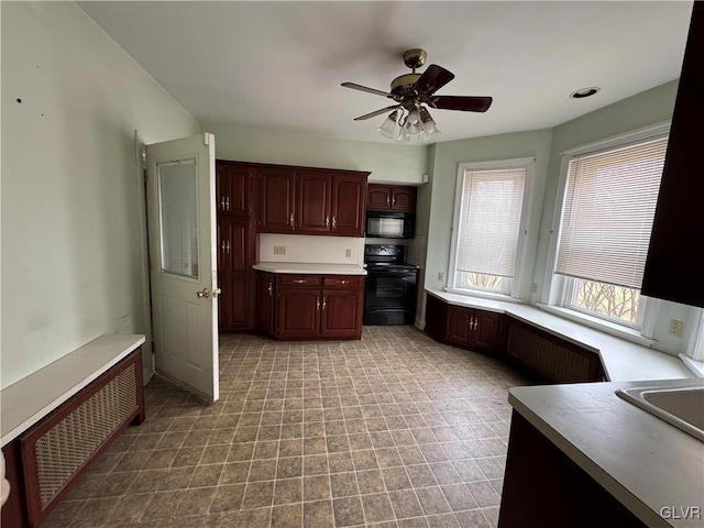 kitchen with black appliances, light countertops, and ceiling fan