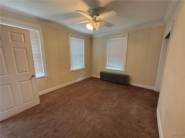 unfurnished room featuring crown molding, radiator heating unit, baseboards, and dark carpet