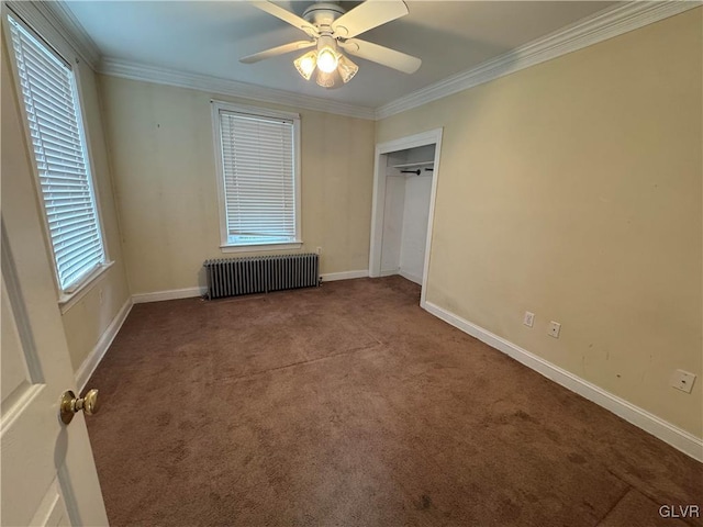 unfurnished bedroom with radiator, crown molding, baseboards, and carpet floors