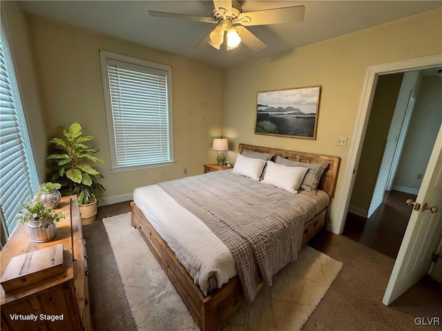 bedroom featuring baseboards and ceiling fan