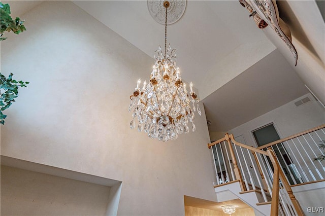 interior details featuring an inviting chandelier and visible vents