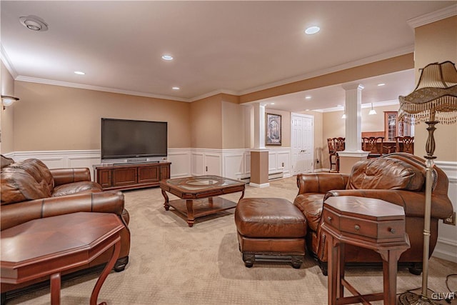 living area with recessed lighting, wainscoting, light carpet, and ornate columns