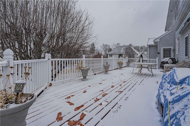 view of snow covered deck