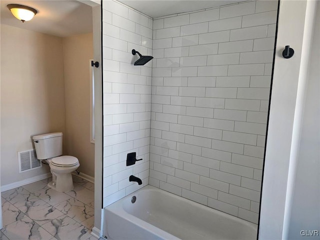 bathroom with marble finish floor, shower / bath combination, visible vents, toilet, and baseboards