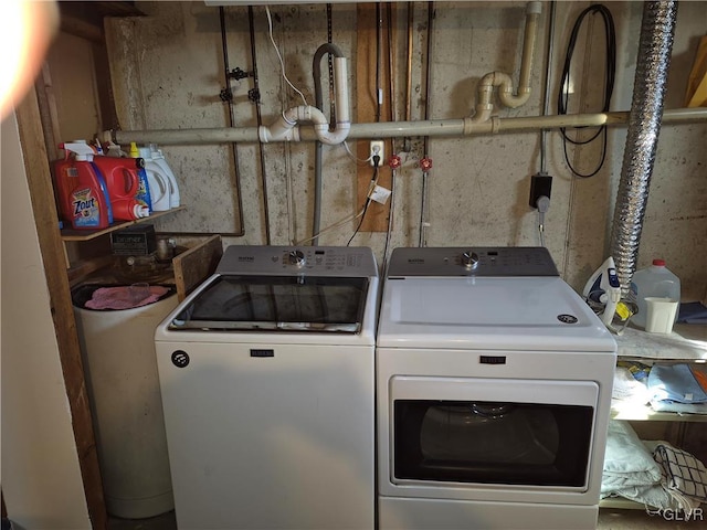 laundry area featuring washing machine and dryer and laundry area