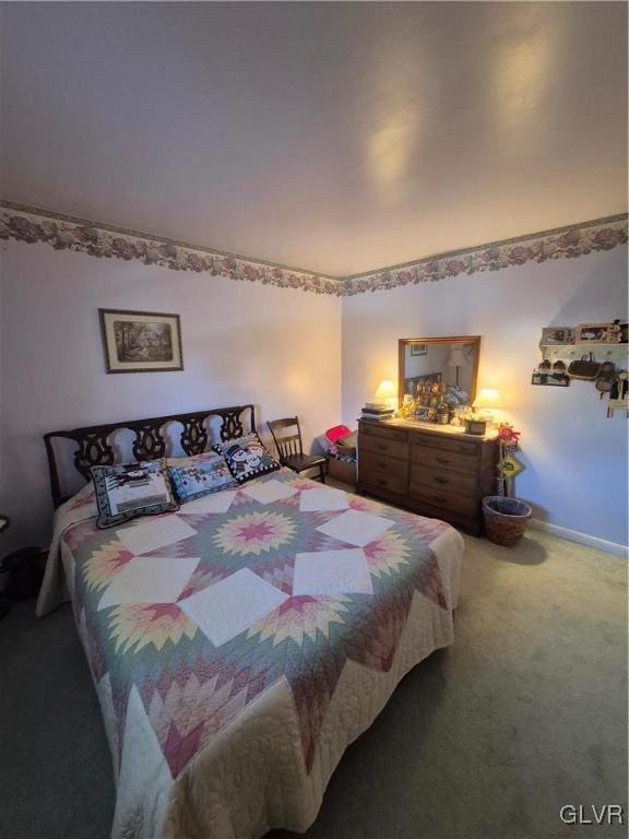 carpeted bedroom with baseboards