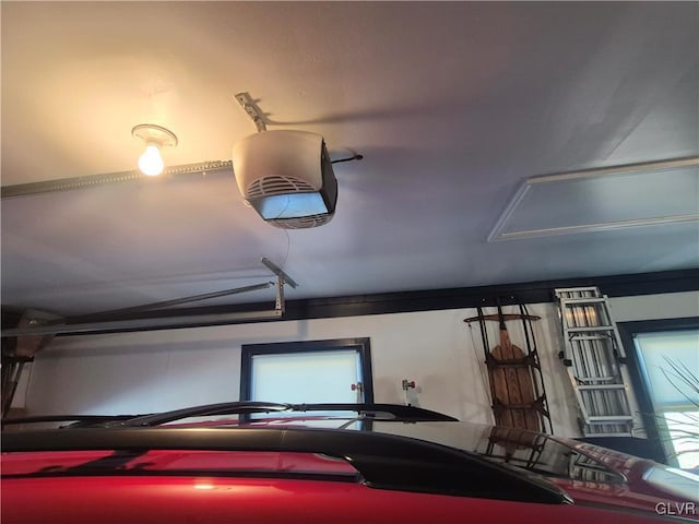 garage featuring a garage door opener