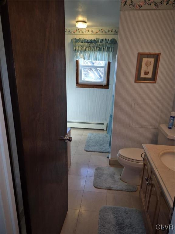 full bath featuring toilet, a baseboard radiator, tile patterned flooring, and vanity