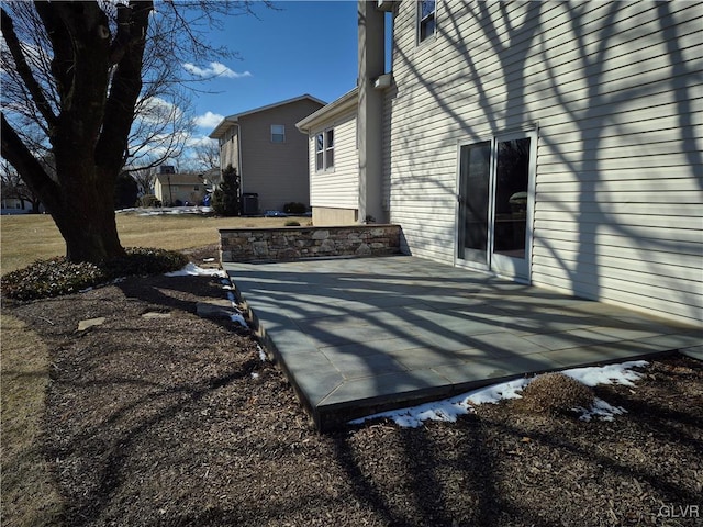 view of property exterior with a patio area