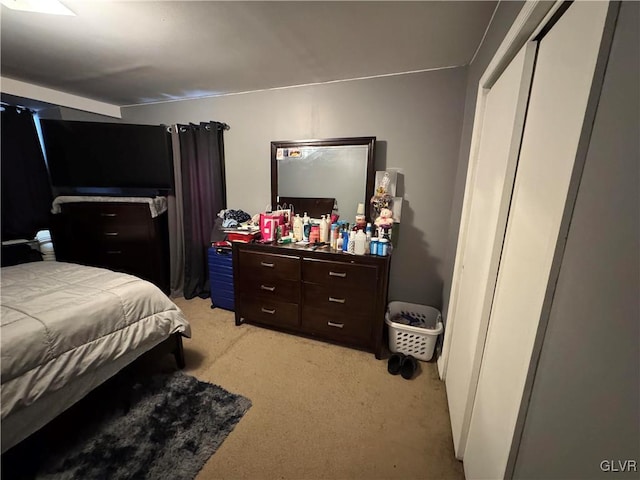 bedroom featuring light carpet