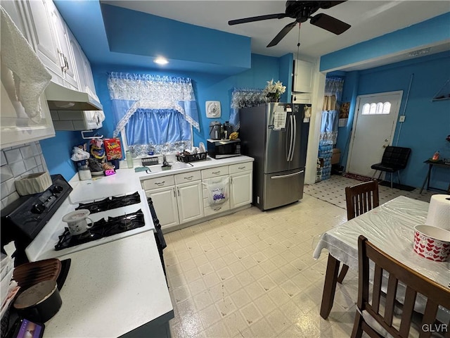 kitchen featuring white cabinets, light floors, stainless steel appliances, and light countertops