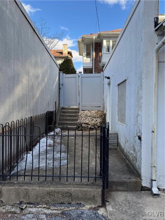 view of gate featuring fence