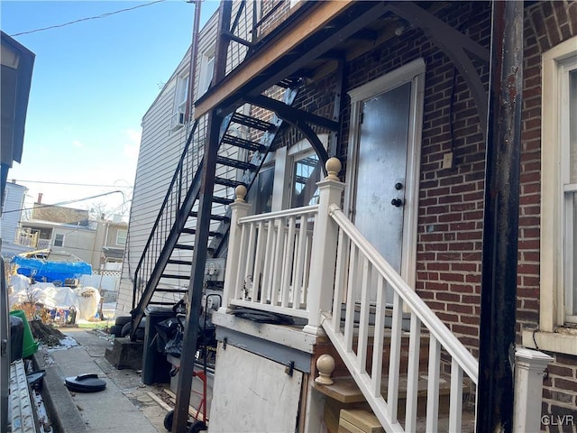 property entrance with brick siding