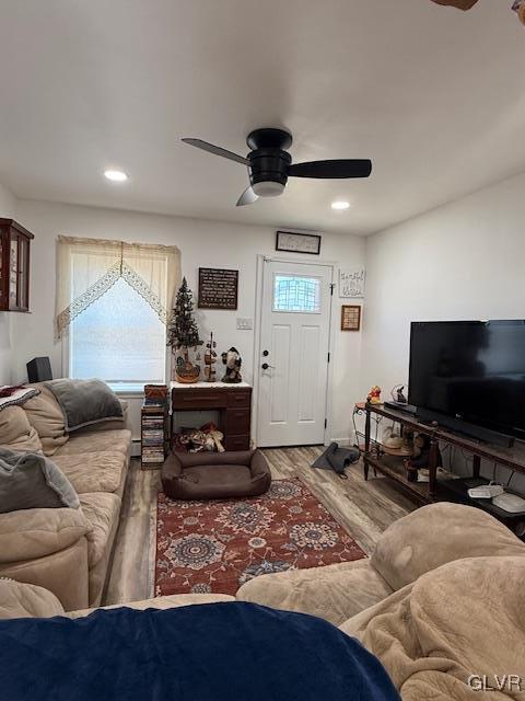 living room with recessed lighting, a ceiling fan, and wood finished floors