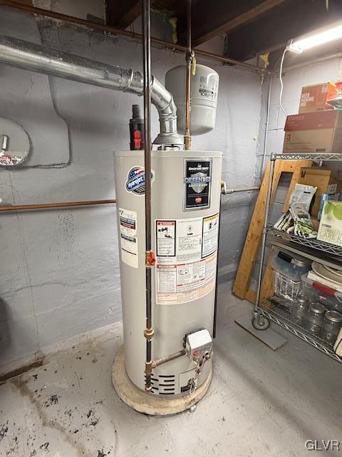 utility room featuring gas water heater