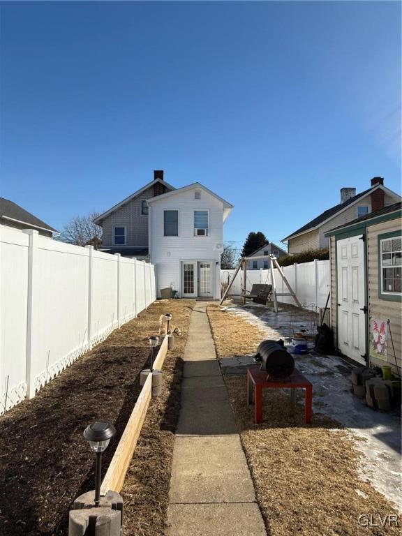 exterior space with a fenced backyard