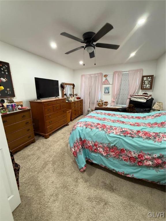 carpeted bedroom with ceiling fan