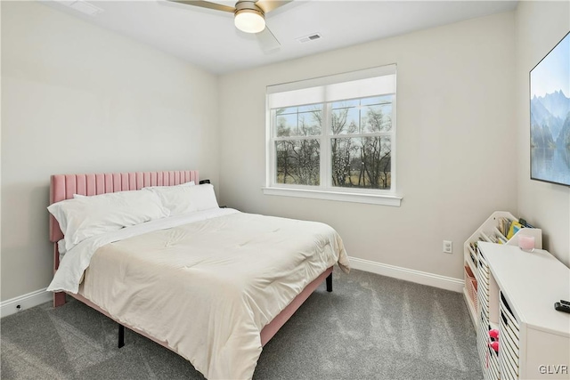 bedroom with a ceiling fan, dark colored carpet, visible vents, and baseboards