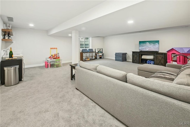 carpeted living room featuring recessed lighting, visible vents, and baseboards