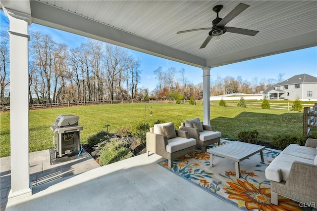 view of patio with ceiling fan, an outdoor hangout area, area for grilling, and fence