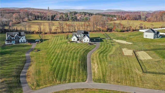 aerial view with a mountain view and a rural view