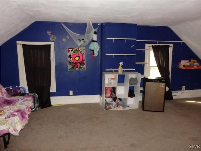 rec room with lofted ceiling and carpet flooring