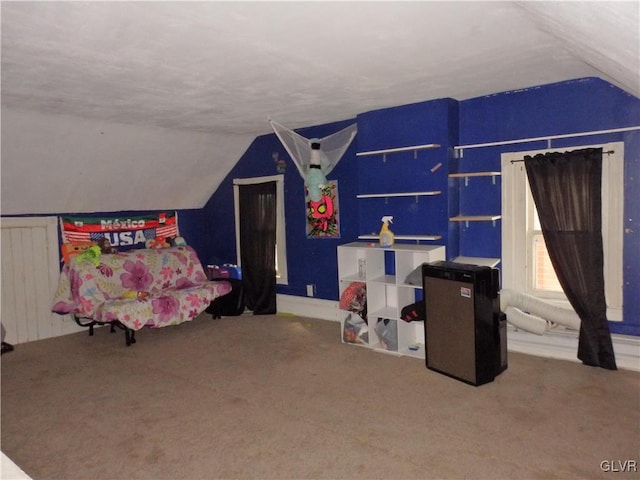 playroom with lofted ceiling and carpet