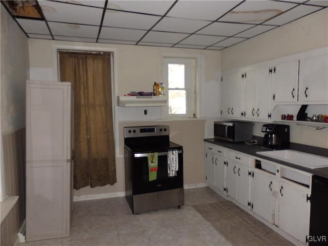 kitchen with open shelves, dark countertops, appliances with stainless steel finishes, white cabinets, and under cabinet range hood