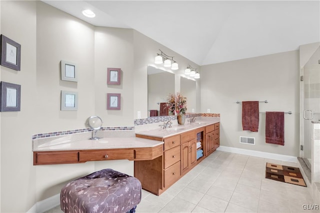 full bathroom featuring double vanity, visible vents, vaulted ceiling, and a sink