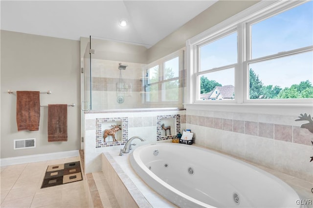 full bathroom with a jetted tub, a stall shower, visible vents, and a wealth of natural light