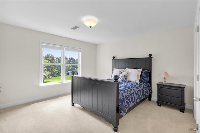 bedroom with light carpet, baseboards, and visible vents