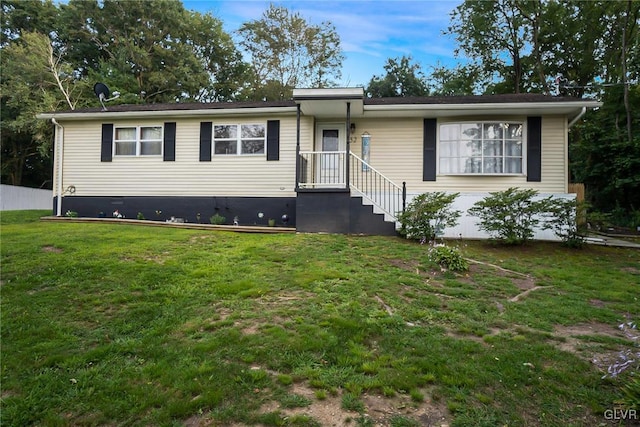 single story home with a front lawn and crawl space