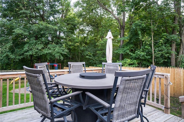 wooden terrace with fence and outdoor dining space