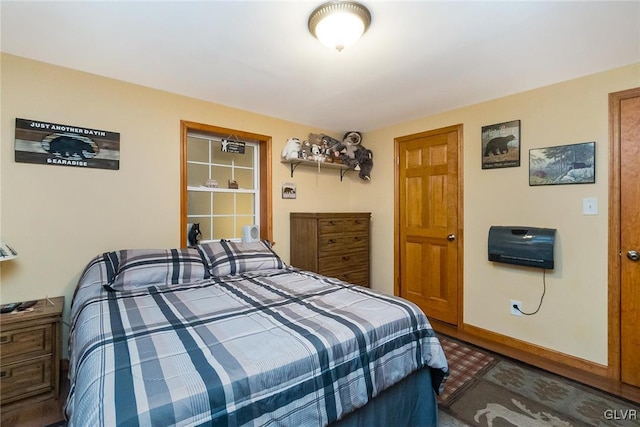 bedroom featuring baseboards