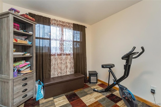 exercise room with baseboards